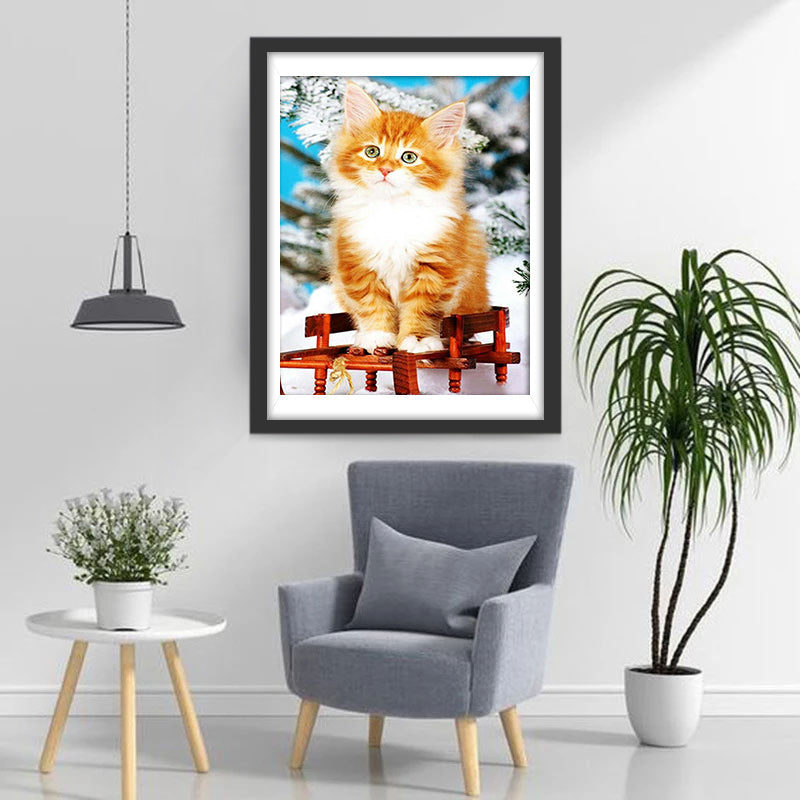 Een Kat op een Rode Stoel in de Sneeuw Diamond Painting