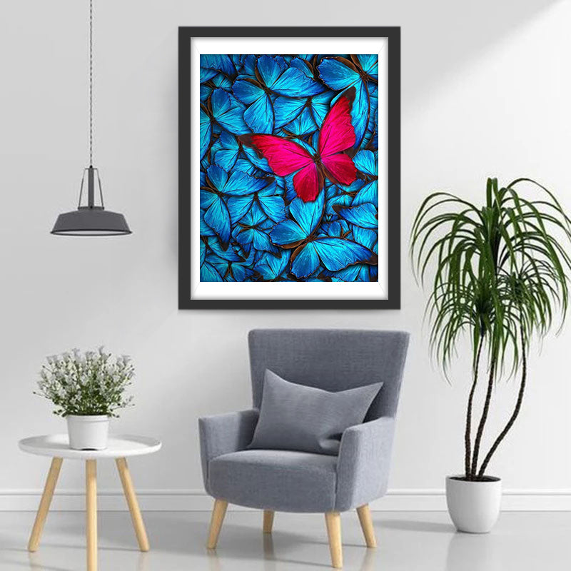 Een Rode Vlinder en een Zwerm Blauwe Vlinders Diamond Painting