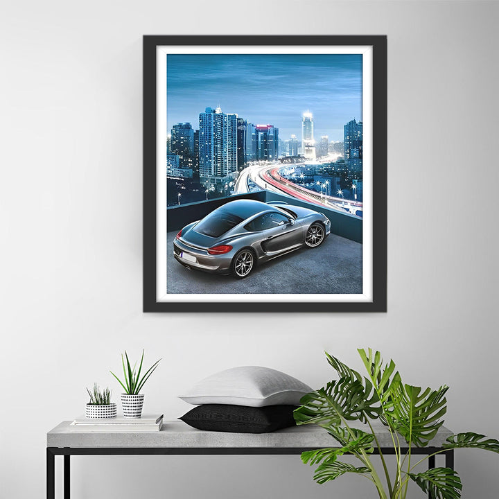 Opvallende Auto en Glimmende Stadshorizon Diamond Painting